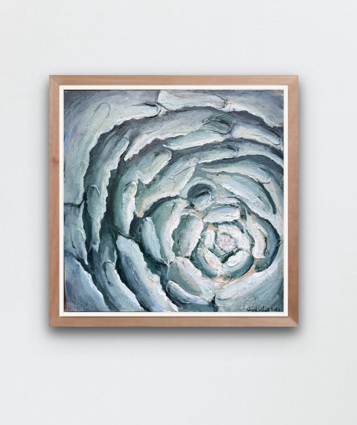 a contemporary painting of a close up of a blooming flower in blues is hung on a white wall