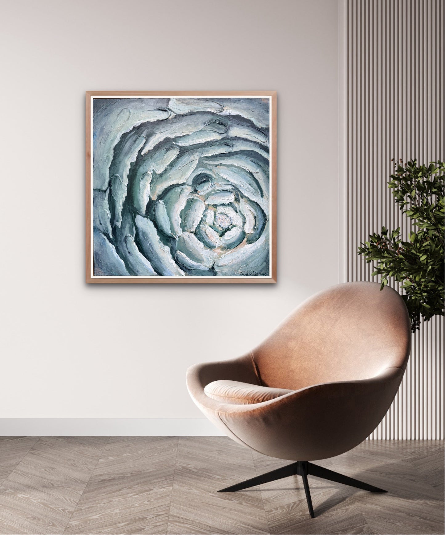 a contemporary painting of a close up of a blooming flower in blues hangs on a neutral wall over a modern brown chair and a plant