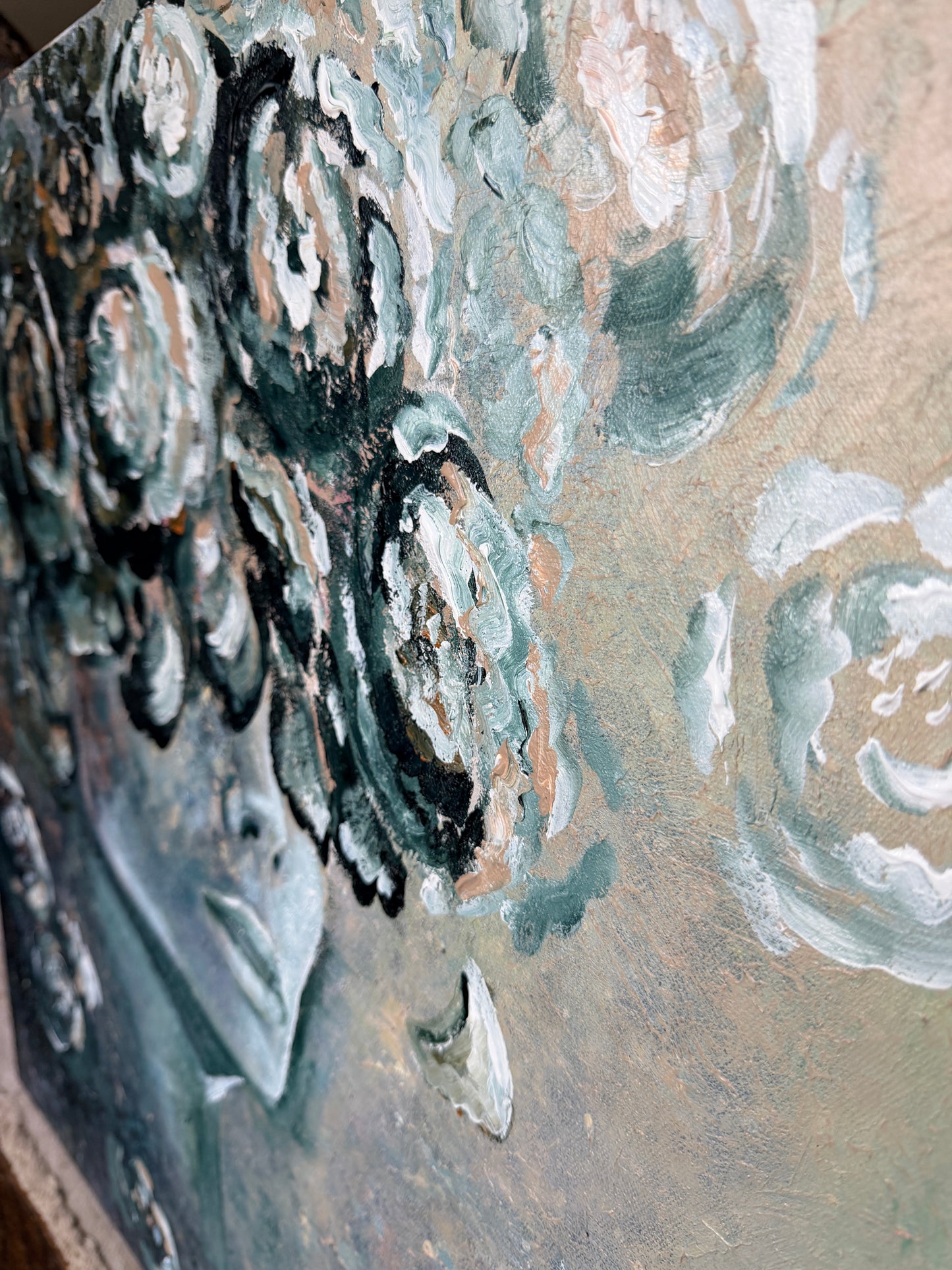 Close-up of a textured surface with abstract patterns in green, black, and white.