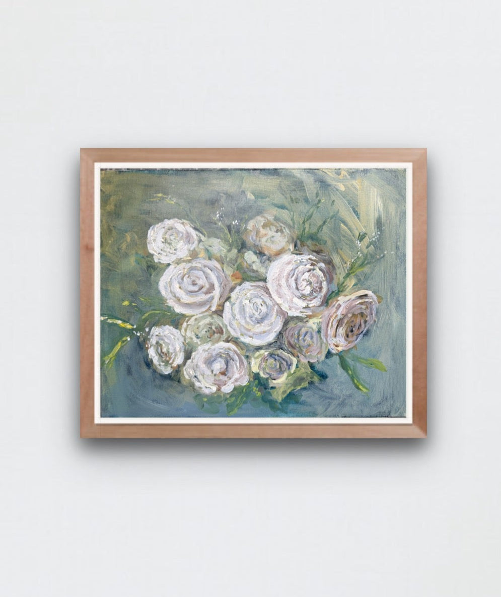 a painting of white roses on a blue green background hangs on a white wall