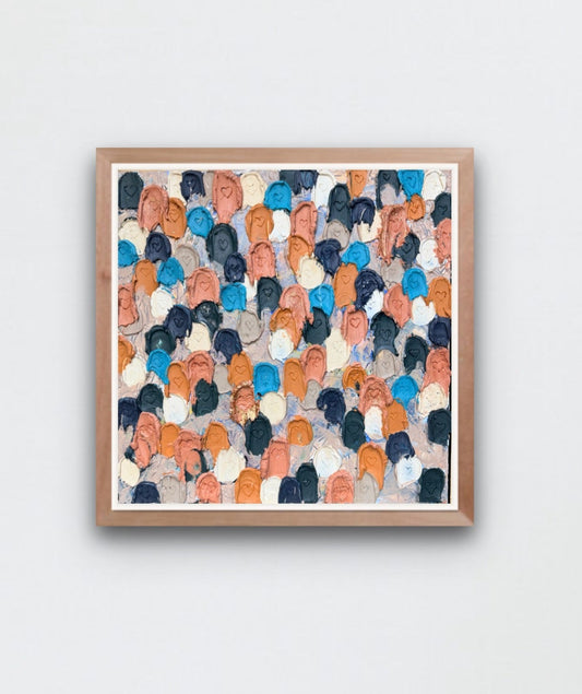 Modern interior with a colorful abstract painting close up of heavily textured painting of dollops of navy, cream, rose gold, and raw sienna with heart carved in them on a white wall.
