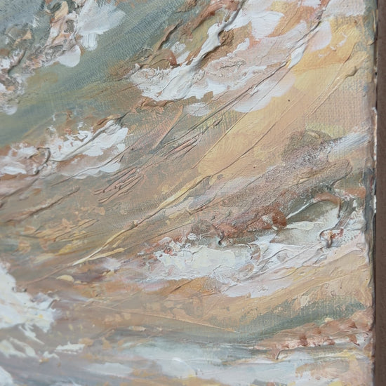 video of a close up of a muted tone textured beach painting