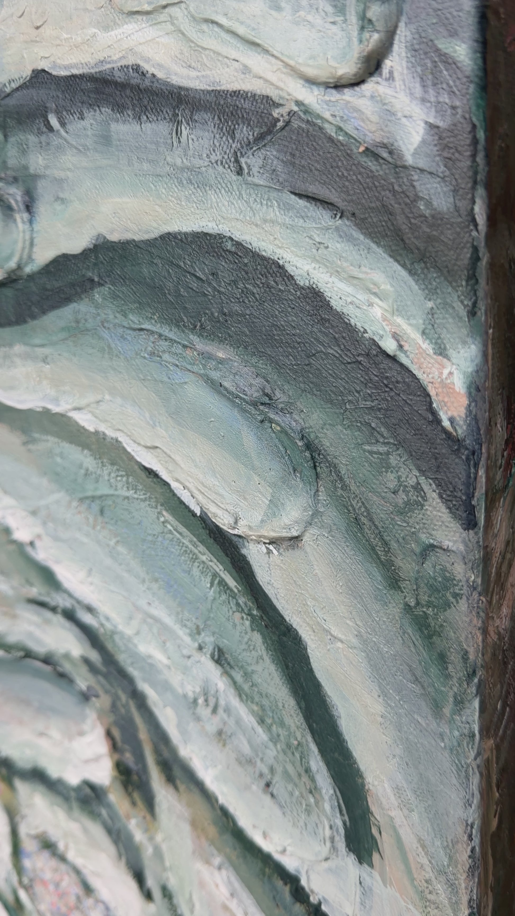 a close up of the details of the bloom painting, shows texture and navy, green, white painting