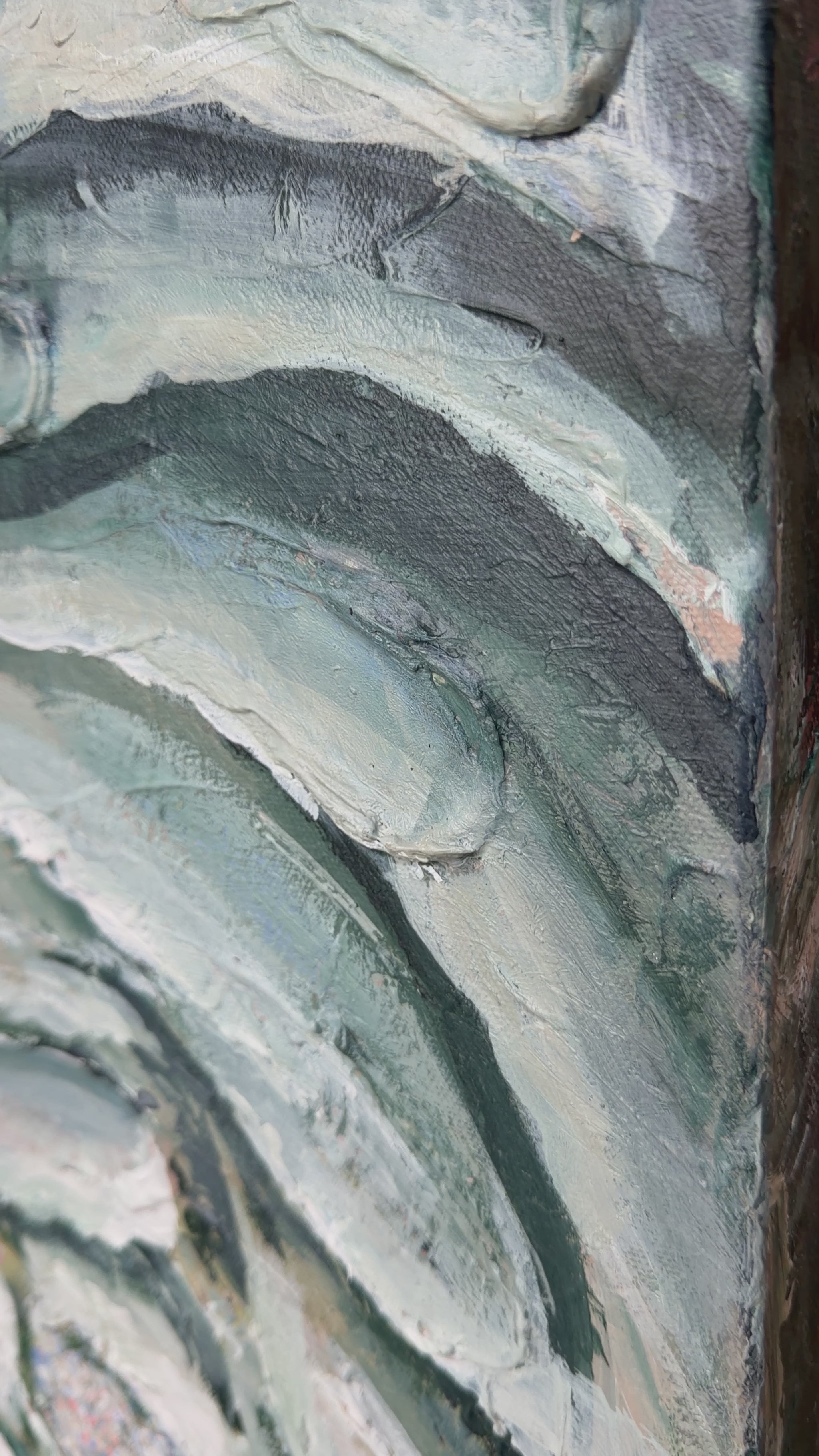 a close up of the details of the bloom painting, shows texture and navy, green, white painting