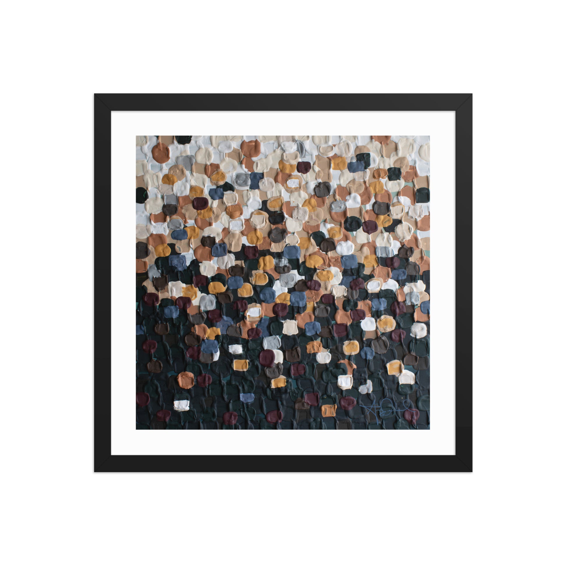 An abstract pointillism piece of framed art in a black frame 
