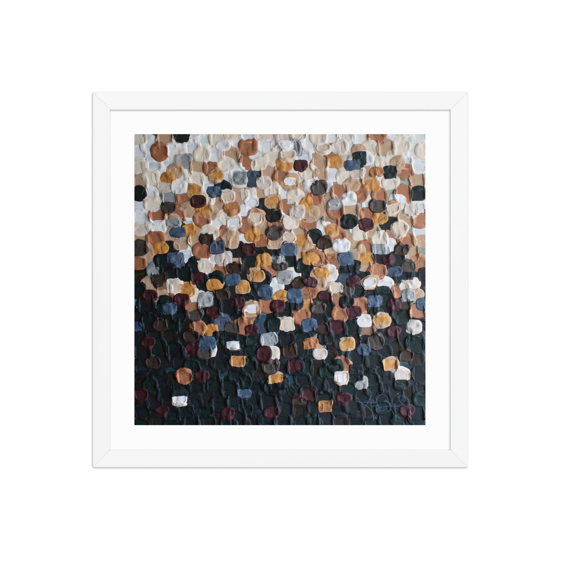 An abstract pointillism piece of framed art in a white frame 