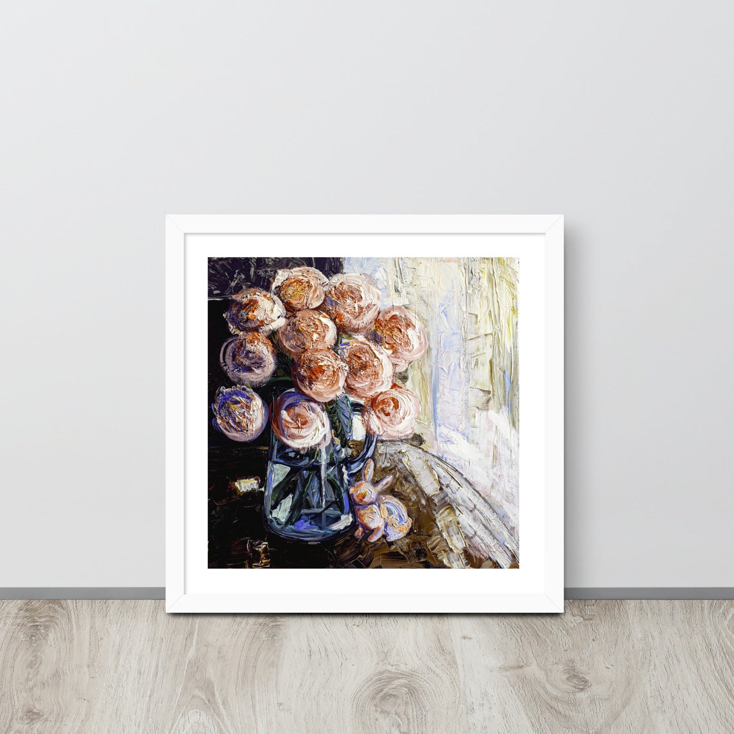 an expressionist painting of a vase of pink flowers in a white frame leaned up against a wall