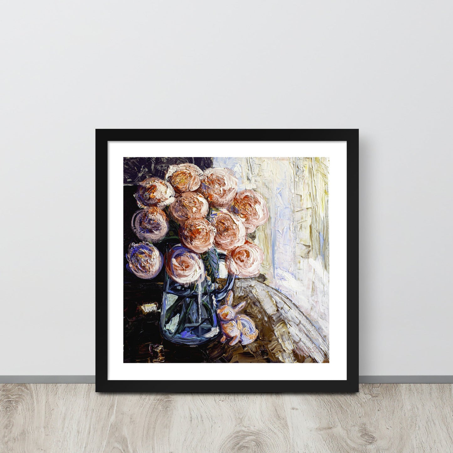 an expressionist painting of a vase of pink flowers in a black frame leaned up against a wall