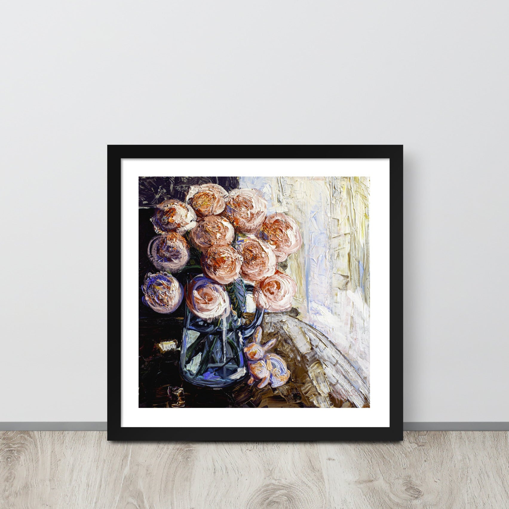 an expressionist painting of a vase of pink flowers in a black frame leaned up against a wall