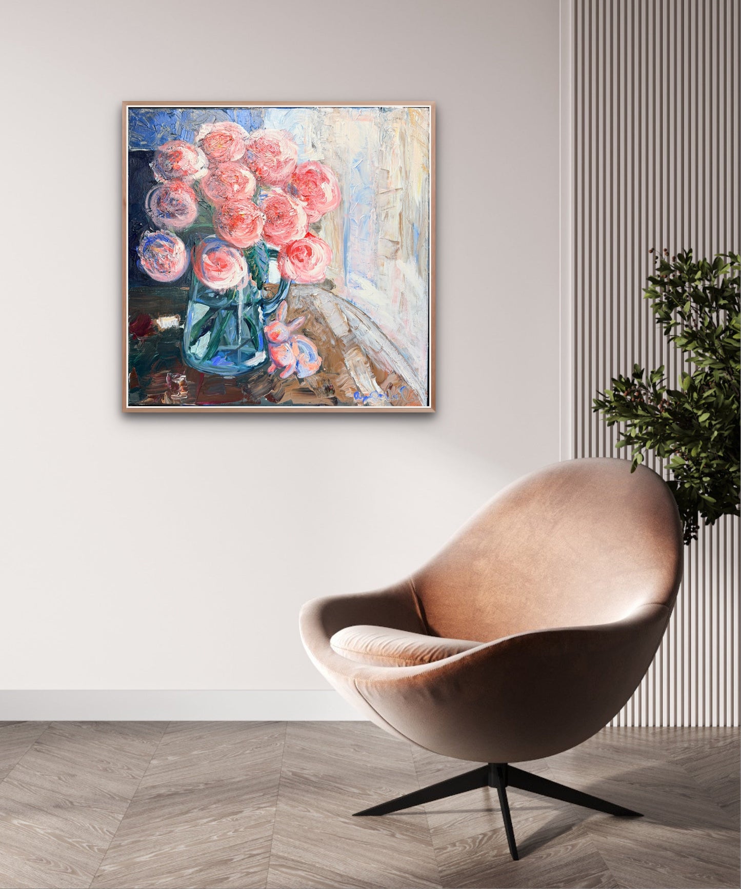 Framed abstract painting of flowers on a wall above a modern chair.
