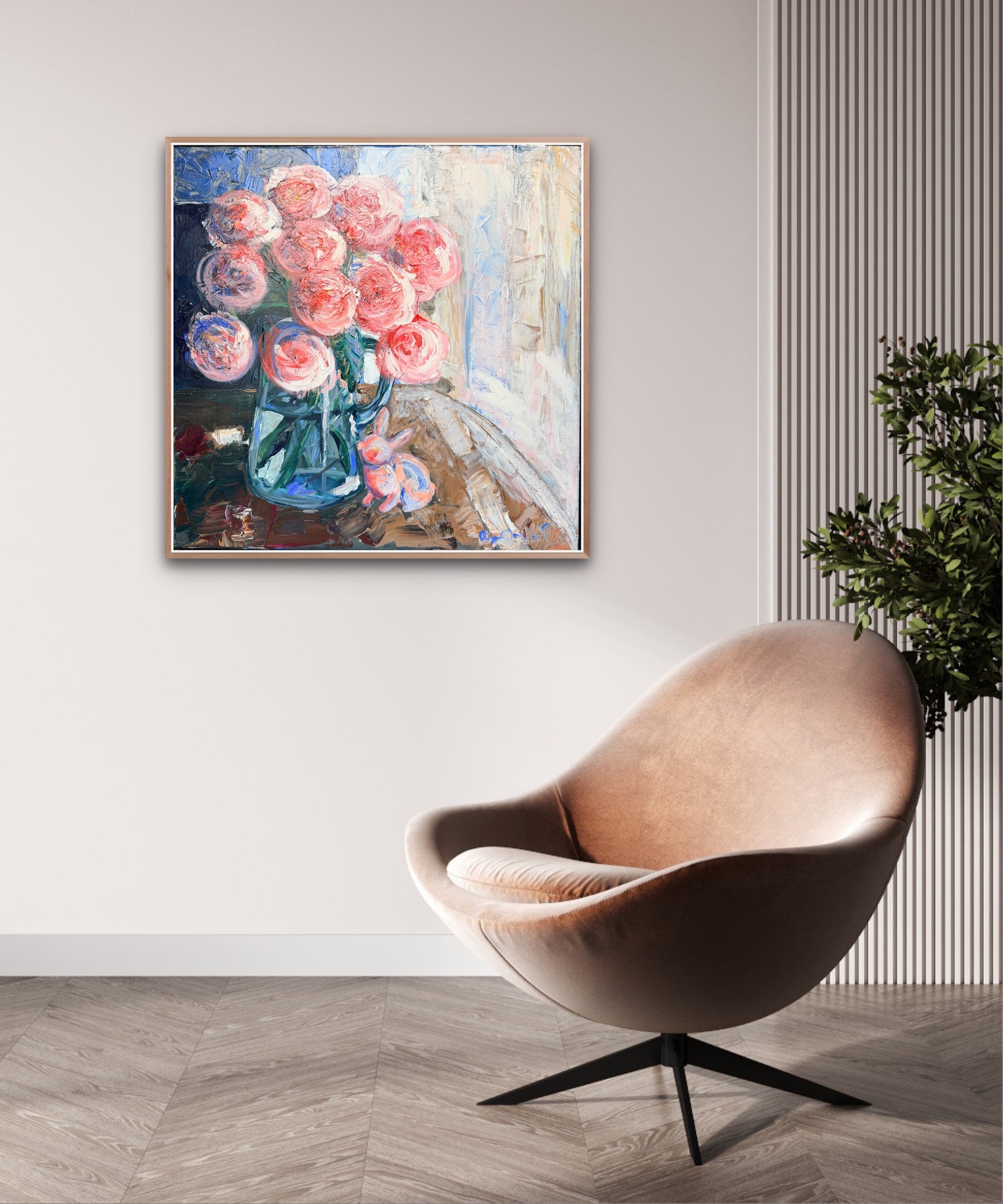 Framed abstract painting of flowers on a wall above a modern chair.